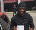 Rickye with Driving test pass certificate